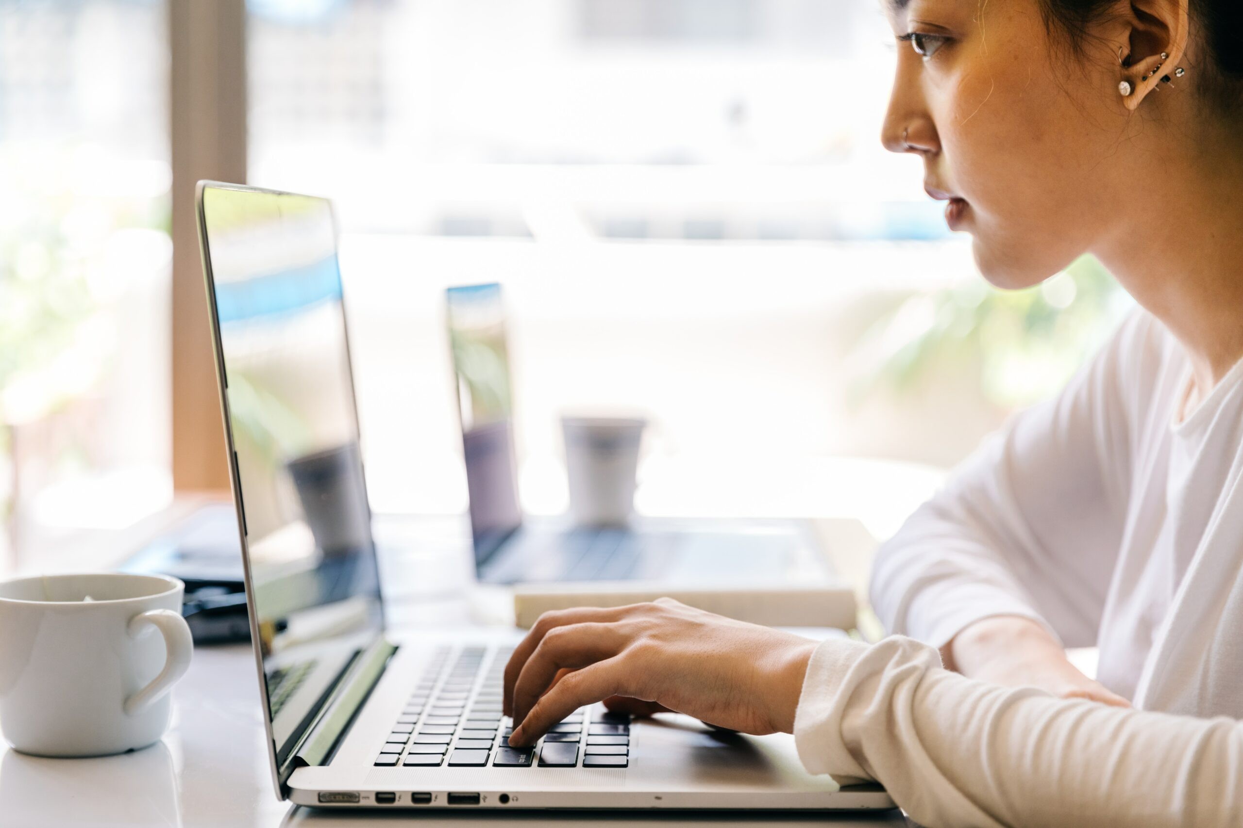 Woman works at laptop