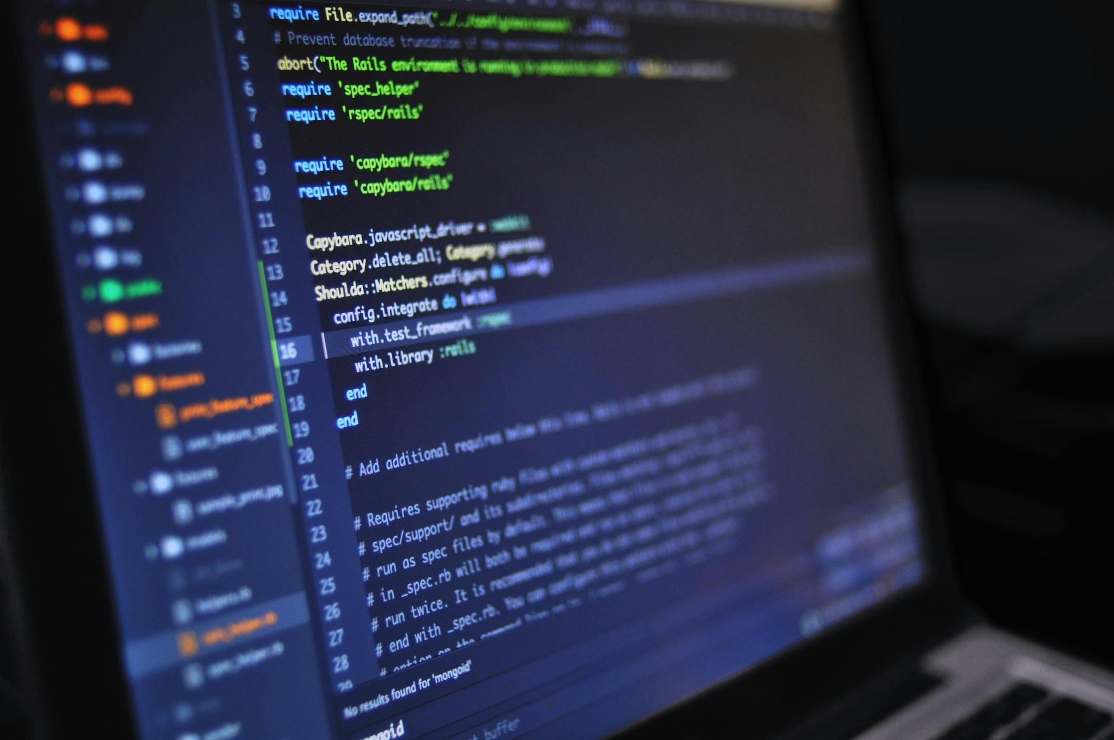 Close-up of hands typing code on a laptop, symbolizing the practical application of coding skills.