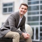 Randy sitting outside Rowan Hall.