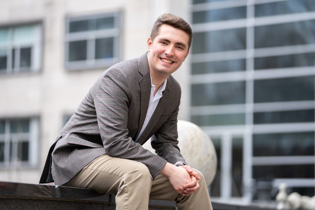 Randy sitting outside Rowan Hall.